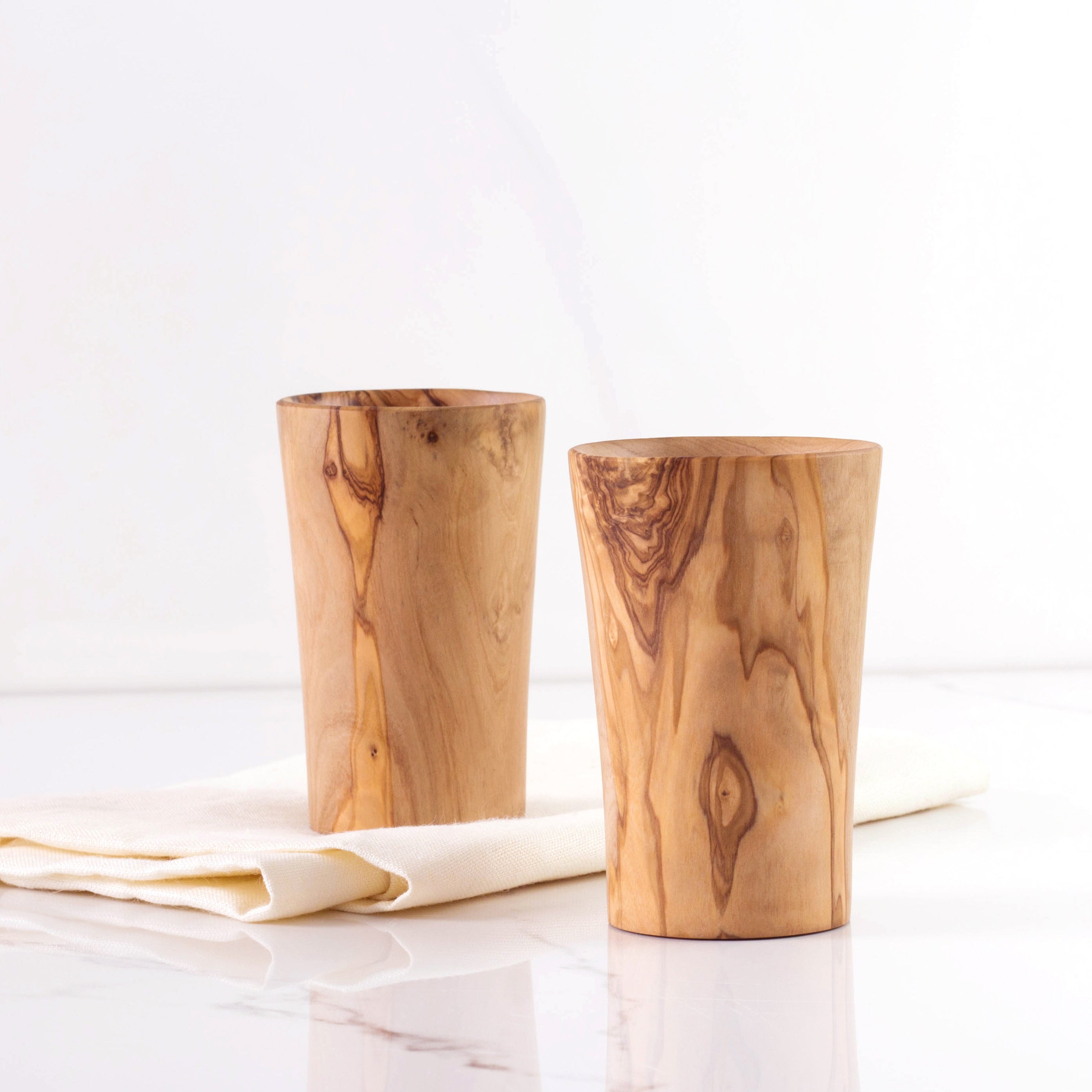 Rustic Elegance Olive Wood Cup: This handmade cup offers a sophisticated rustic touch for any drink occasion. Crafted from sustainable olive wood, it merges eco-friendliness with timeless style.